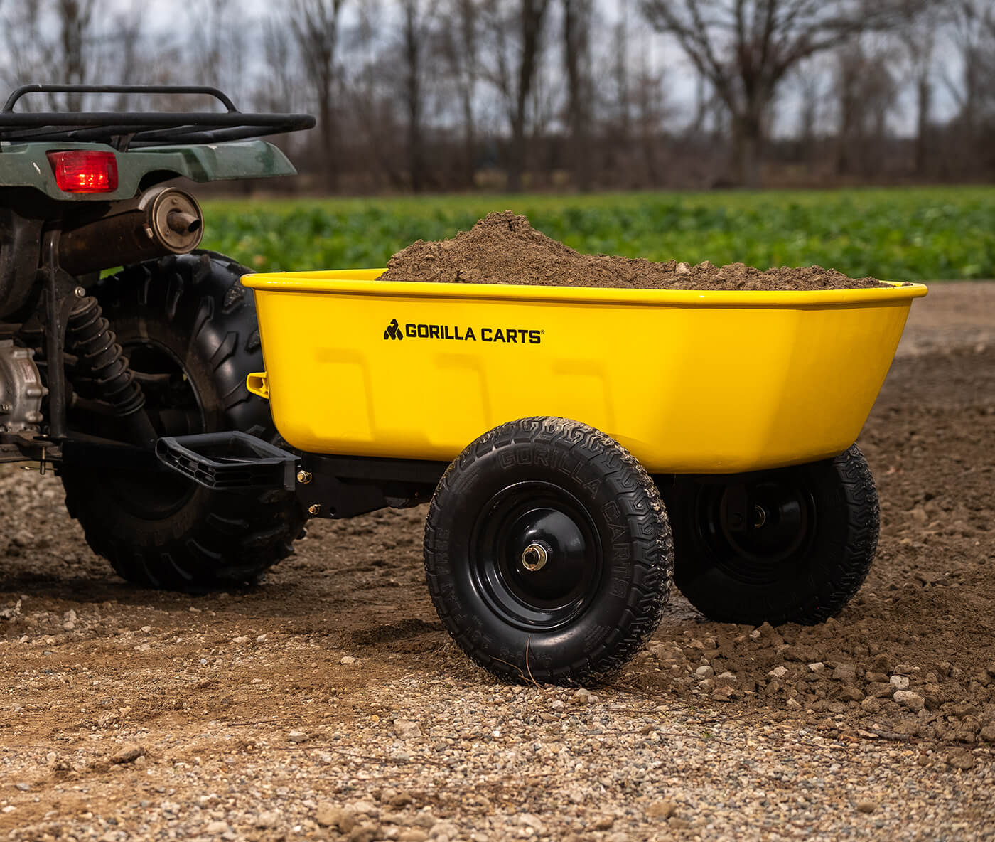 GCPT-8-C filled with dirt attached to a tractor