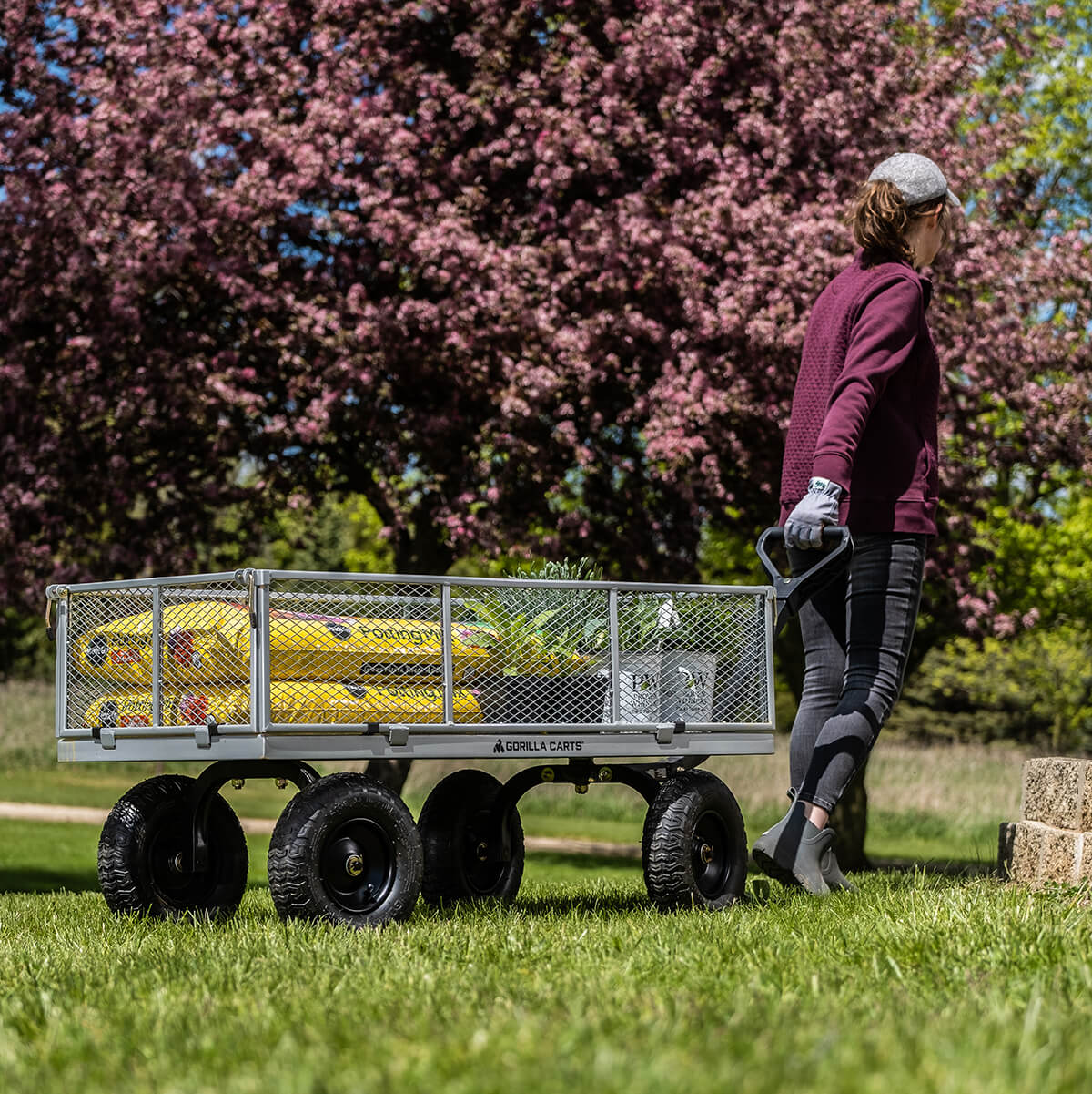 man pulling GOR-1201-2 with Gardening supplies